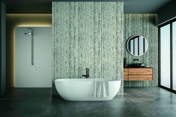 Modern bathroom interior with blue and white tones wall, concrete floor, wooden vanity with black sink and oval mirror, white bathtub, panoramic windows.